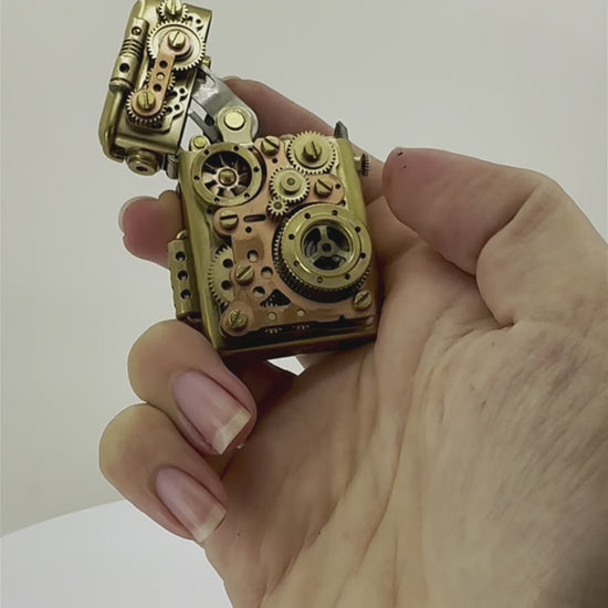 Vintage kerosene brass lighter with auto lighting feature and gears.