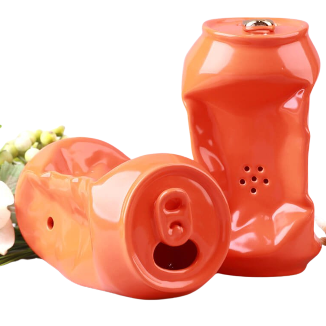 Two ceramic orange soda can pipe