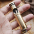 A vintage brass kerosene trench lighter.