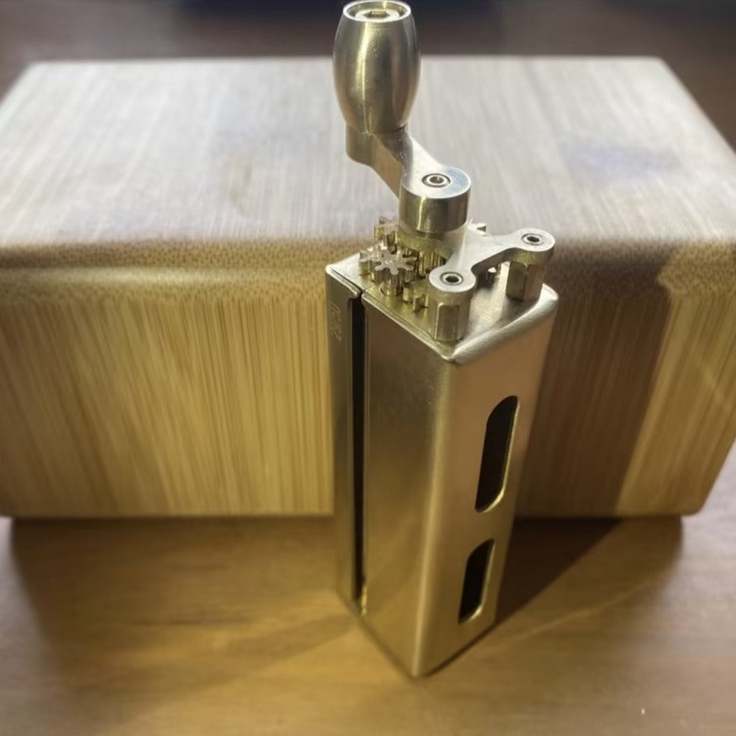 Solid brass tobacco joint rolling machine with lever.