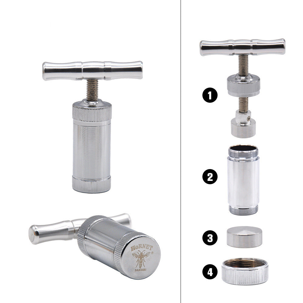 Parts of a silver pollen kief press.