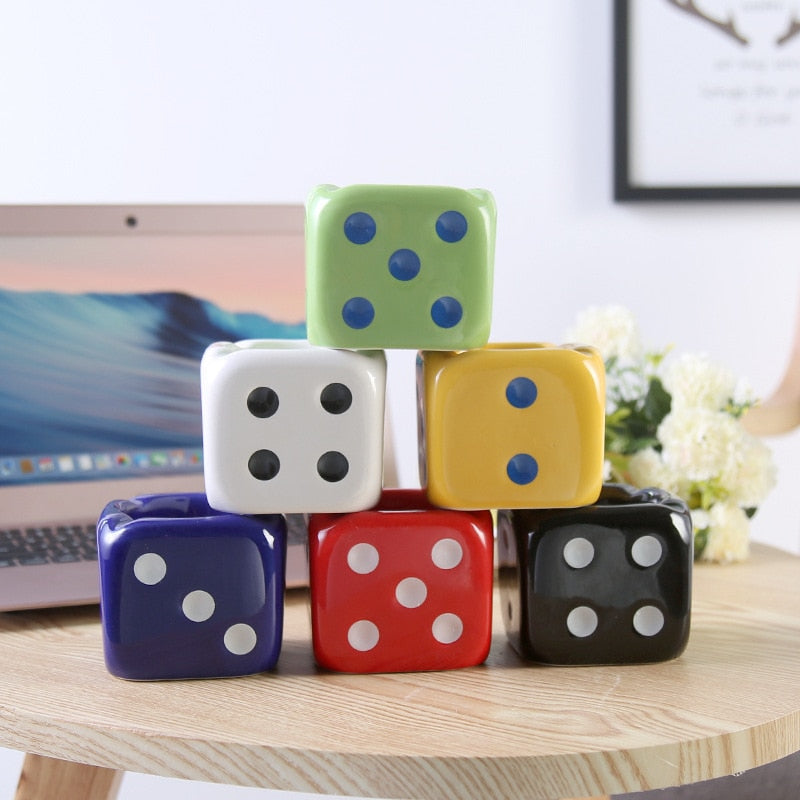 Green, white, yellow, blue, red and black dice ashtray.