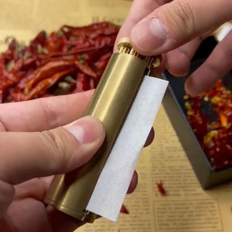 A 70mm brass rolling cigarette machine made of copper.