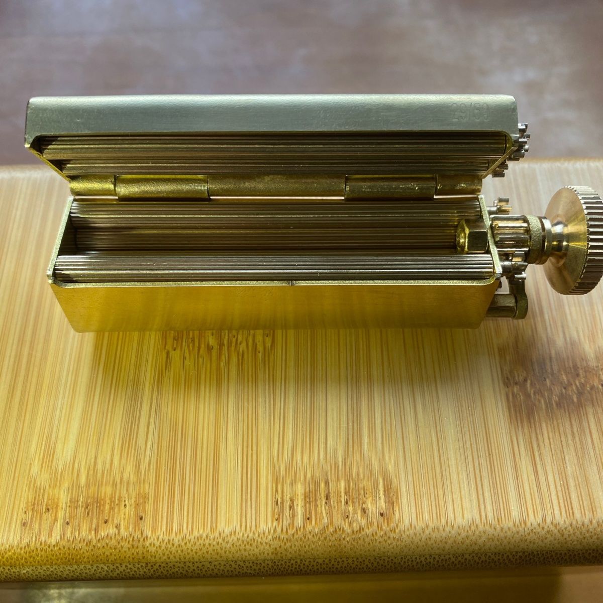 Brass rolling cigarette machine made of copper.