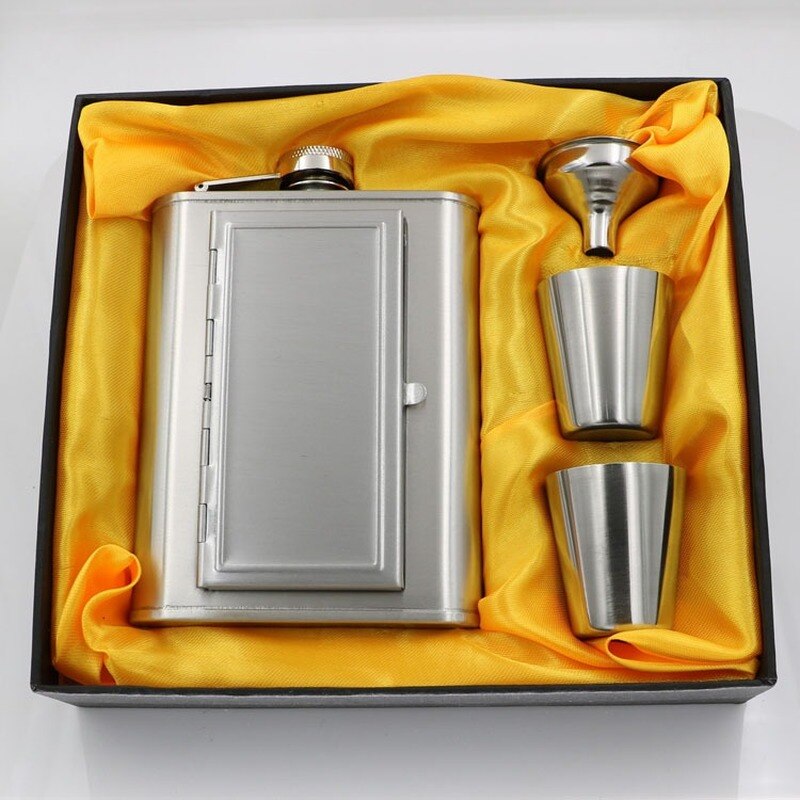 A whiskey flask with a cigarette compartment and two stainless steel shot glasses.